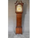 A 19th century oak cased eight day longcase clock with brass dial, has weights and pendulum (not