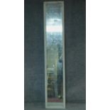A tall pier mirror in white painted frame fitted with faux aged glass. 200x38cm