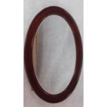 An Edwardian mahogany framed wall mirror in bevelled plate. 89x65cm