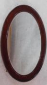 An Edwardian mahogany framed wall mirror in bevelled plate. 89x65cm