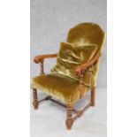 An antique style oak framed open armchair. H.102cm