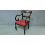 A late Georgian mahogany open armchair with drop in seat on turned tapering reeded supports. H.85cm