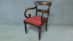 A late Georgian mahogany open armchair with drop in seat on turned tapering reeded supports. H.85cm