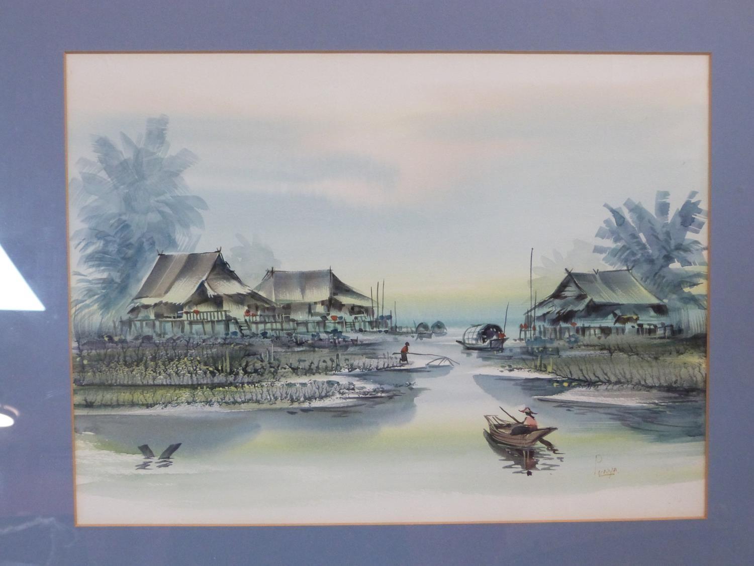 A framed and glazed Oriental watercolour on paper of an Asian village with boatman and palm trees. - Image 2 of 5