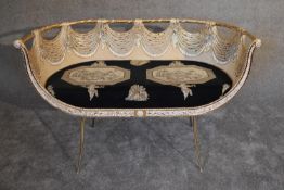 A gilt metal framed two seat tub shaped canape with fitted classical design squab cushion. H.75 x