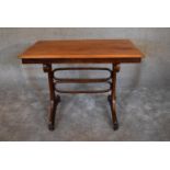 A 19th century bentwood table stamped Austria with a worn original makers label to underside.