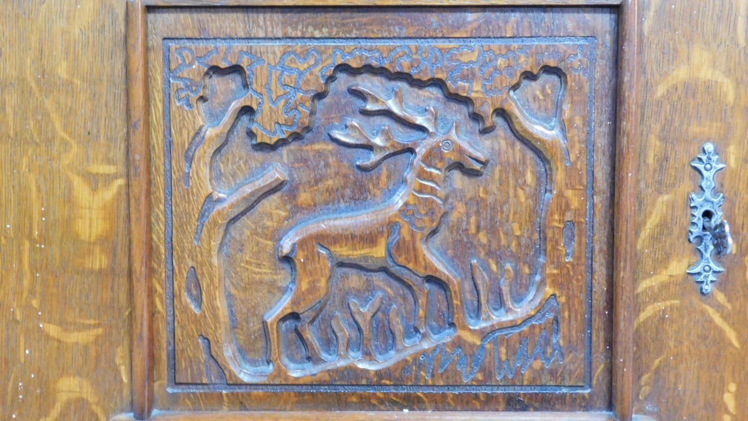 A mid 20th century Continental carved oak sideboard decorated with animal and scroll work - Image 6 of 11