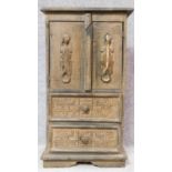 A fitted teak cabinet with Aztec tribal style carving. H.81 W.45 D.25cm