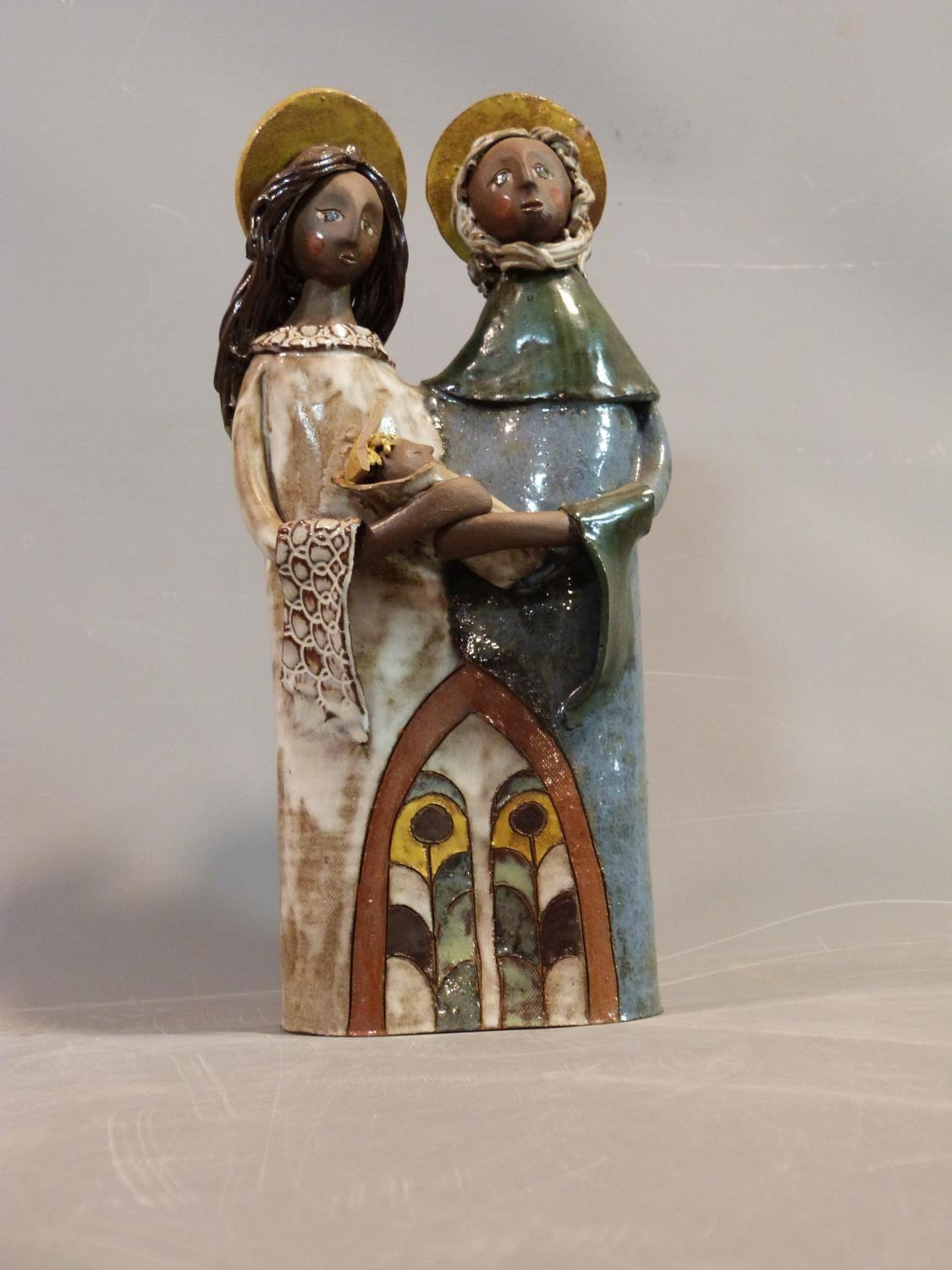 A collection of ceramic figures and a candle holder by American Potter Dinny Bondybey. Some signed