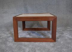 A mid 20th century teak coffee table with inset tiled top. H. 40 x 65cm