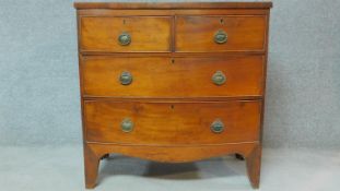 A 19th century mahogany bowfronted chest of two short over three long drawers on bracket feet. H.