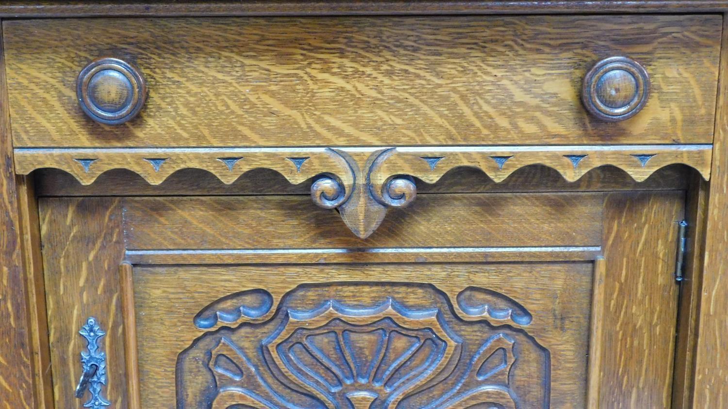 A mid 20th century Continental carved oak sideboard decorated with animal and scroll work - Image 7 of 11