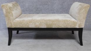 A Regency style upholstered scroll end window seat on sabre supports. H.67 W.129 D.56cm
