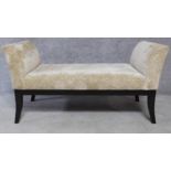 A Regency style upholstered scroll end window seat on sabre supports. H.67 W.129 D.56cm