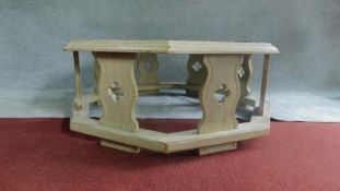 A large hexagonal distressed painted and iron bound two tier centre table. H.48cm W.121cm D.121cm