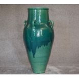 A Large Green drip glazed sherab wine vessel with four handles. H.86cm