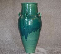 A Large Green drip glazed sherab wine vessel with four handles. H.86cm