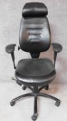 A black leather upholstered executive's desk chair with various tilting actions. H.94cm