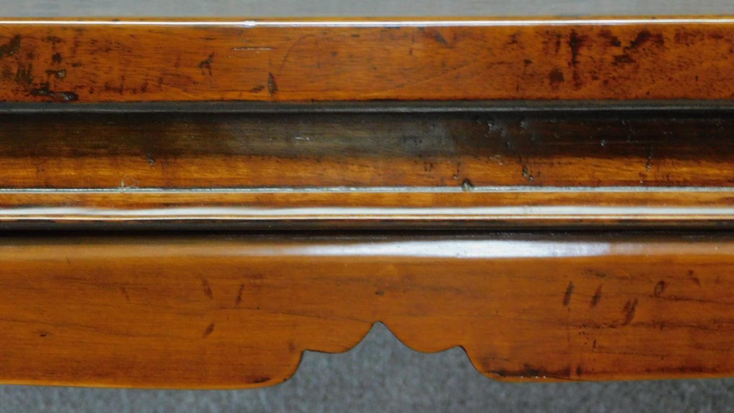 A Chinese teak centre table on shaped tapering square section supports. H.87 W.135 D.89cm - Image 4 of 5