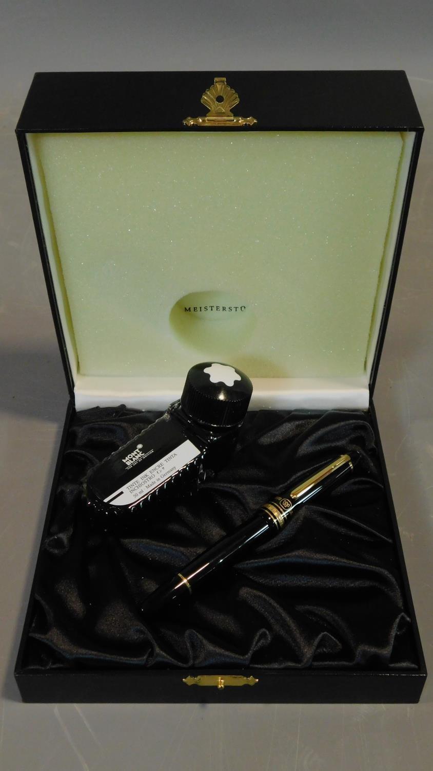 A Montblanc black and gold fountain pen in a Warner Music International black leather presentation