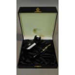 A Montblanc black and gold fountain pen in a Warner Music International black leather presentation