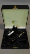 A Montblanc black and gold fountain pen in a Warner Music International black leather presentation