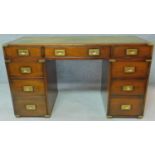 A Georgian style mahogany brass bound military campaign desk with inset green tooled leather top.