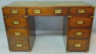 A Georgian style mahogany brass bound military campaign desk with inset green tooled leather top.