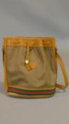 A vintage 80's tan leather and Gucci Canvas drawstring bucket bag with red and green striped