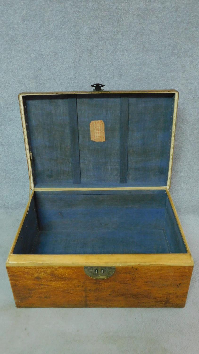 A Chinese lacquered travelling trunk with twin carrying handles. H.40 W.81 D.55cm - Image 4 of 7
