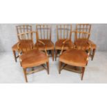 A set of six Georgian elm dining chairs with wheatsheaf carved splats on square tapering supports.
