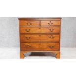A Georgian mahogany chest of two short over three long drawers on bracket feet. H.94 W.95 D.57cm