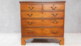 A Georgian mahogany chest of two short over three long drawers on bracket feet. H.94 W.95 D.57cm