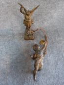 A hanging gilded cherub light fitting with chain and a gilded cast metal statue of San Miguel