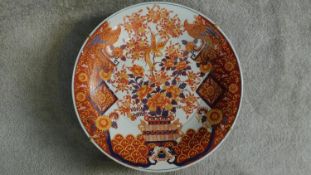 A large Chinese/Japanese hand painted Imari charger with floral and phoenix motifs. Six character