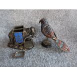 An antique silver plate and blue enamel elephant match holder with gilded details and an indian