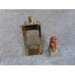 A vintage brass singing decanter and a painted monkey tin plate light. Sings Little Brown Jug. H