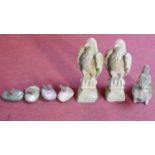 A miscellaneous collection of seven garden figures to include a pair of eagles and various cast iron