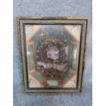 An early Victorian framed wax flower marriage wreath, circa 1893. Carved gilt frame and mirror panel