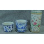 Two blue and white planters and a Chinese umbrella stand with floral detailing. H.46cm