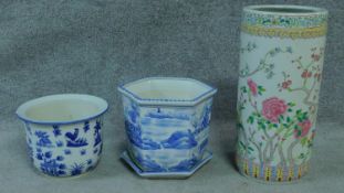 Two blue and white planters and a Chinese umbrella stand with floral detailing. H.46cm