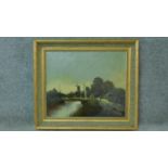 A gilt framed oil on canvas depicting a landscape with windmill, signed WL Smith. 67x78cm