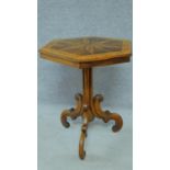 A mid Victorian bird's eye maple and rosewood centre table with profuse Arabesque inlay with tilt