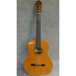 A vintage acoustic guitar by Santos Martinez. Model SM20. H.99cm