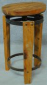 An adjustable industrial style stool. H.57cm