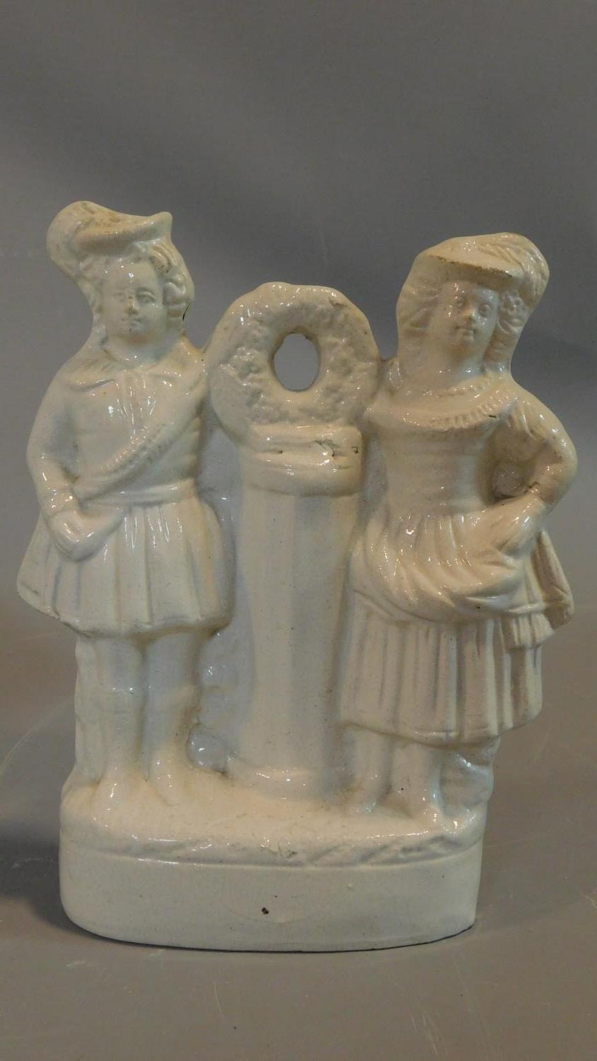 A collection of five early porcelain and earthenware figures, including a man with a bill, a - Image 5 of 8