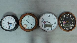 Four modern wall clocks. 42x38cm (largest)