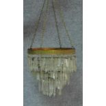 A gilt metal framed hanging basket chandelier with crystal drops. H.32 D.36cm