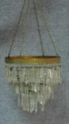 A gilt metal framed hanging basket chandelier with crystal drops. H.32 D.36cm