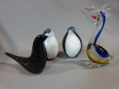 Four art glass birds, a pair of penguins, a pelican and a song bird. Tallest 28cm.